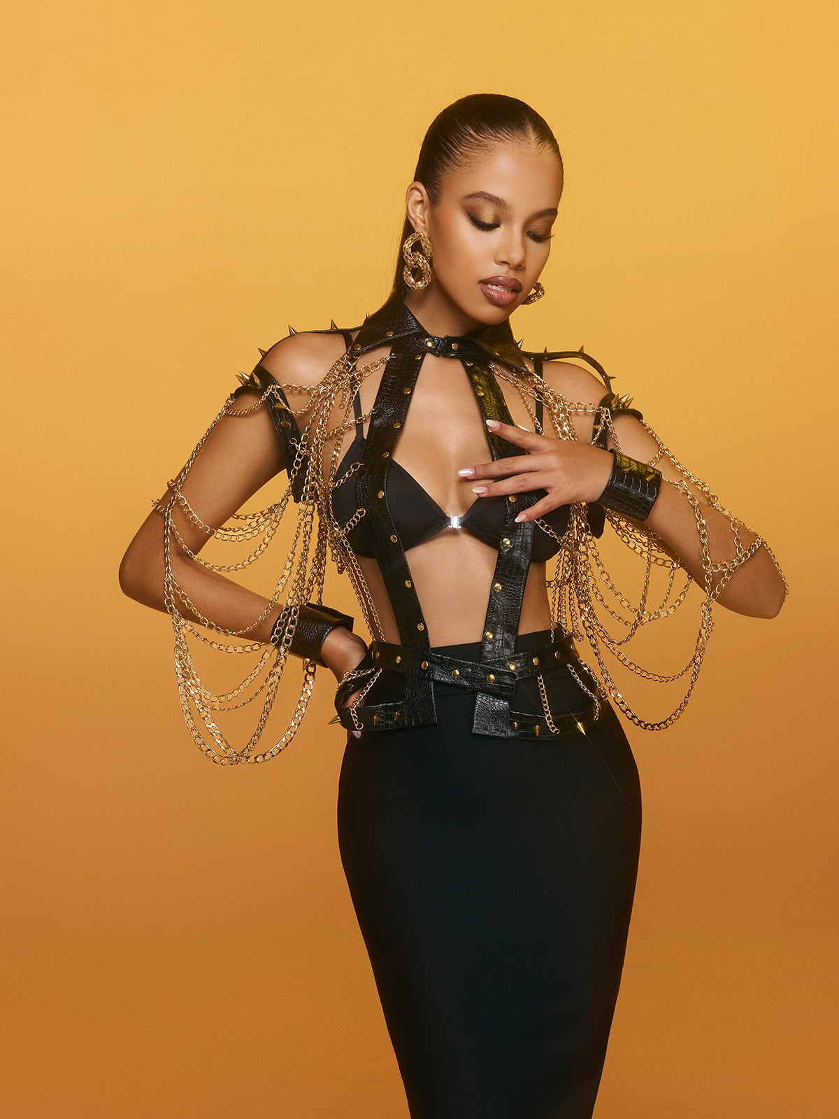 Top in pelle con catena e punte Renaud