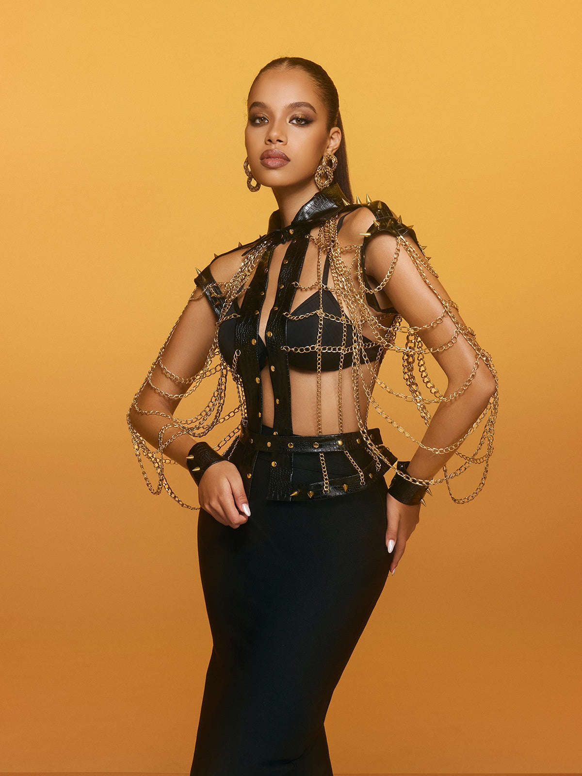 Top in pelle con catena e punte Renaud