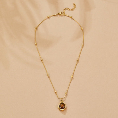 Collana con pendente in pietra ambra